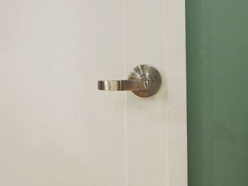 Close-up of door handle on wall