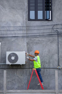 Man repairing air conditioner