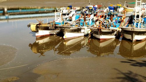 Boats moored on sea