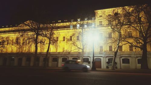 Cars on road in city at night