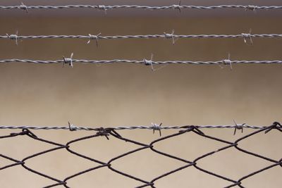 Close-up of barbed wire fence