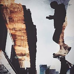 Low angle view of woman against sky