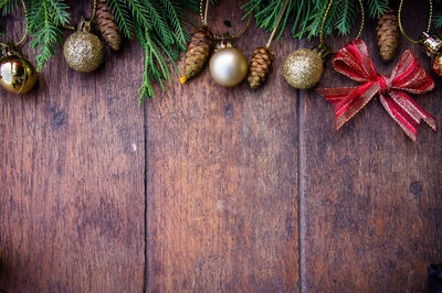 Directly above shot of christmas decorations on wooden table