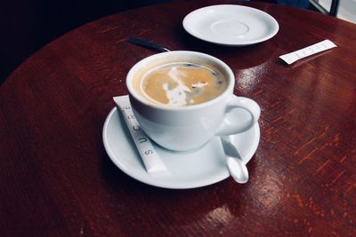 High angle view of coffee cup on table