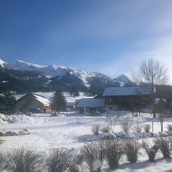 Scenic view of snow covered mountains against sky