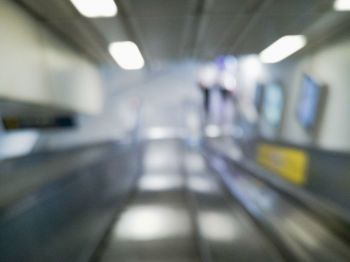 Blurred motion of train at railroad station platform