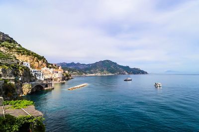 Scenic view of bay against sky