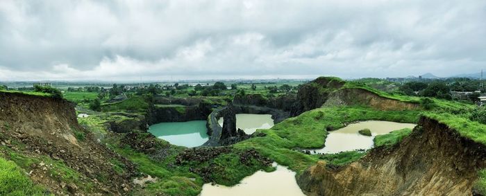 High angle view of river against cloudy sky