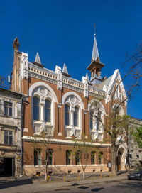 Low angle view of building against blue sky