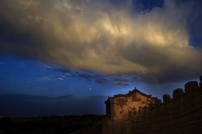 Built structure against cloudy sky