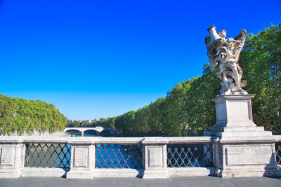 Statue against blue sky