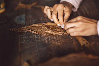 Close-up of person preparing food on table