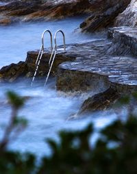 Scenic view of rocks at sea shore