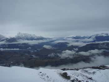 Aerial view of snow covered mountains