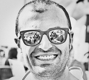 Close-up portrait of man wearing sunglasses