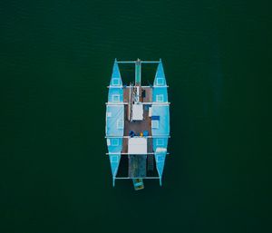 Directly above shot of boats moored on lake at night