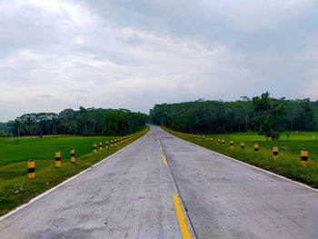 Empty road against sky