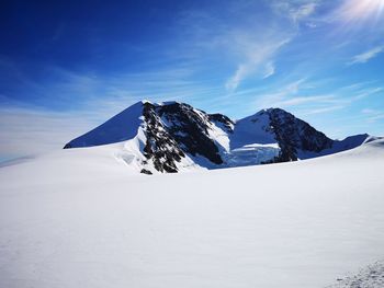 Scenic view of snowcapped mountain against sky