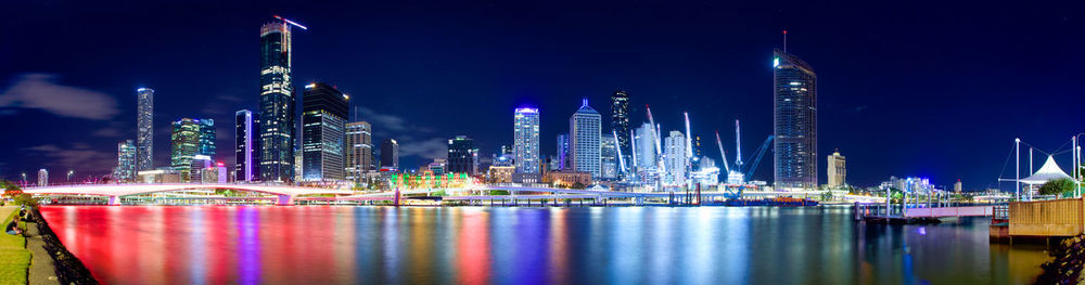 Illuminated modern buildings in city at night