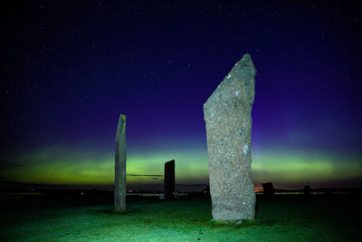 Northern light with stones of stenness, orkney islands, uk. 