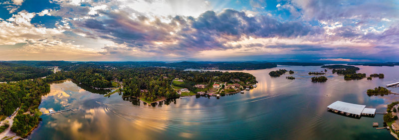 Panoramic shot of river and cityscape against sky