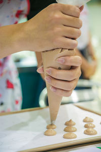 Close-up of hand holding ice cream