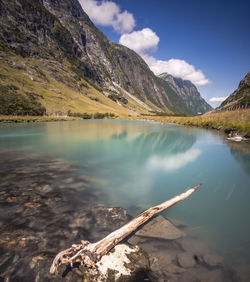 Scenic view of lake and mountains against sky