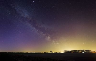 Scenic view of star field against sky at night