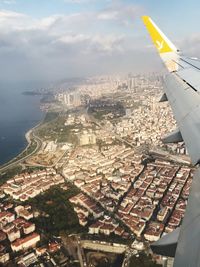 Aerial view of city and buildings against sky