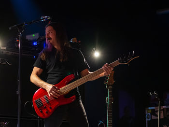 Man playing guitar at music concert