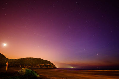 Scenic view of sea against sky at night