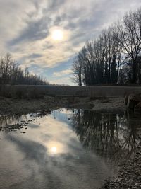 Scenic view of lake against sky during sunset