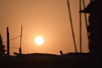 Low angle view of silhouette man against sky during sunset