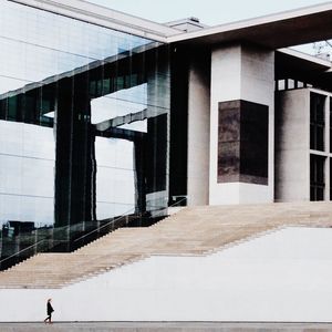 Person standing in front of building