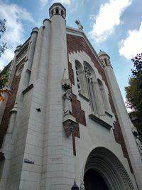 Low angle view of bell tower against sky