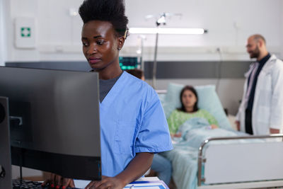 Nurse working on computer at hospital