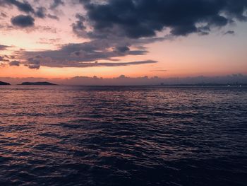 Scenic view of sea against romantic sky at sunset