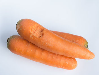 High angle view of carrots on white background
