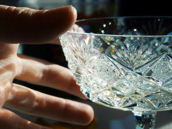 Close-up of person holding glass