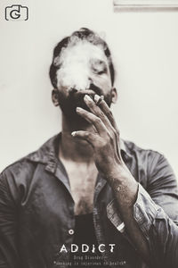 Close-up of man smoking cigarette