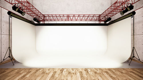 Low angle view of empty benches against wall at home