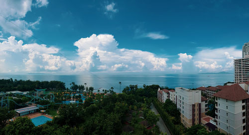 High angle view of townscape by sea against sky