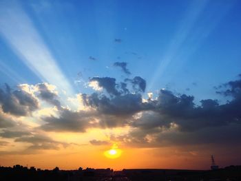 Low angle view of silhouette birds against sunset sky