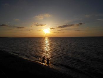 Scenic view of sea at sunset