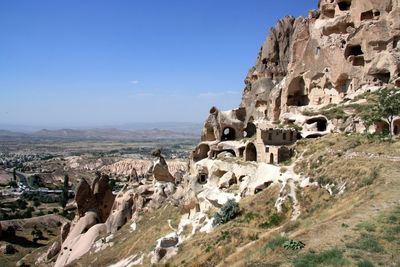 View of uchisar castle against blue sky