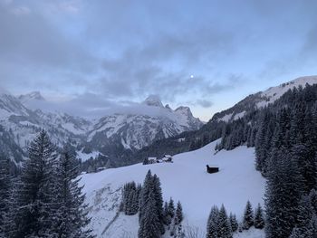 Scenic view of snowcapped mountains against sky