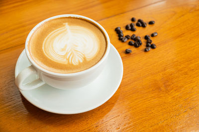 Close-up of cappuccino on table