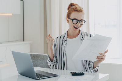 Mid adult woman using smart phone