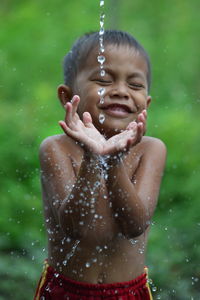 Close-up of a smiling girl in water