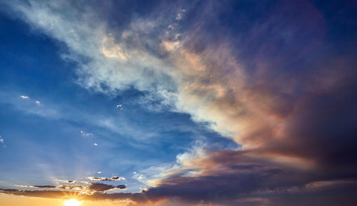 Low angle view of dramatic sky during sunset